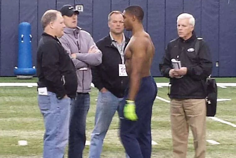 Byron Jones talks to (from left) Chip Kelly, Ed Marynowitz, Bill Davis, and Tom Donahoe of the Eagles during the University of Connecticut's pro day. (@Dan_Hope/Twitter)