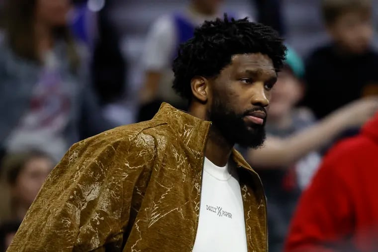 Injured Sixers center Joel Embiid on the bench during the game against the New Orleans Pelicans on March 8.