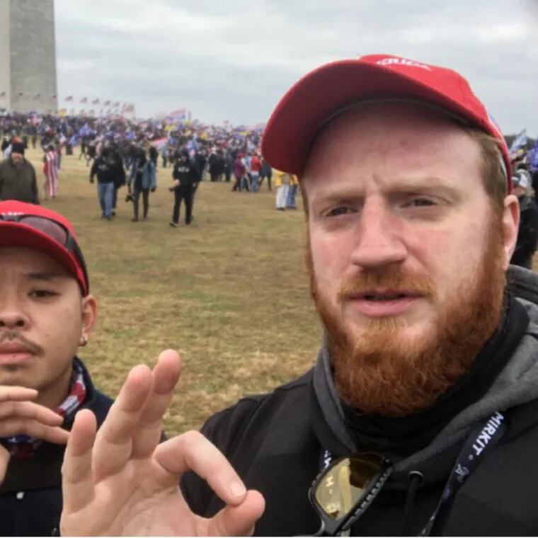 Proud Boy Brian Healion (right) poses for a selfie with Freedom Vy (left) a fellow member of the far-right group's Philadelphia chapter, near the Washington Monument in Washington, D.C. on Jan. 6, 2021.