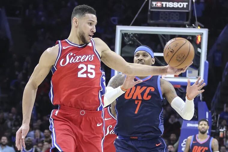 Sixers point guard Ben Simmons takes the ball from Thunder forward Carmelo Anthony in a triple-overtime loss on Friday.