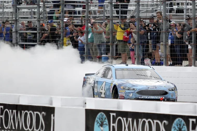Kevin Harvick smokes his tires down the front stretch after winning a NASCAR Cup Series auto race Sunday, July 22, 2018, at New Hampshire Motor Speedway in Loudon, N.H. (AP Photo/Mary Schwalm)