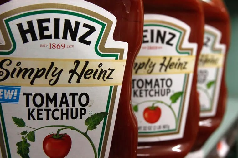 FILE - This March 2, 2011, file photo, shows containers of Heinz ketchup on the shelf of a market, in Barre, Vt. Shares in Kraft Heinz are expected to plunge when markets open Friday, Feb. 22, 2019 after the consumer goods company said it was being investigated by U.S. regulators and it reported a massive loss. (AP Photo/Toby Talbot, File)
