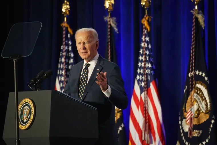 President Joe Biden addresses House Democrats on Friday in Philadelphia.