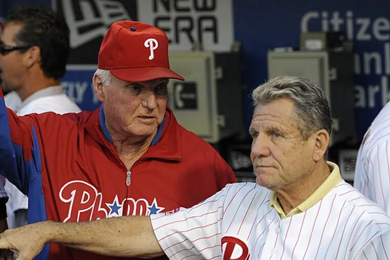Former Phillies managers Charlie Manuel (left) and Larry Bowa (right) are both back in the organization. (Michael Perez/AP)