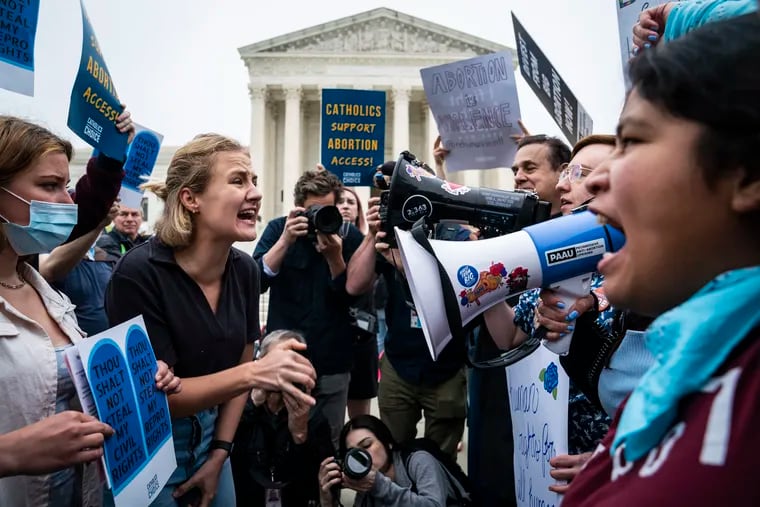 Demonstrators on both sides of the abortion debate gathered outside the U.S. Supreme Court on Tuesday.