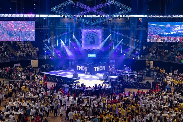 Dancers stand around the stage of the Penn State IFC/Panhellenic Dance Marathon, THON 2023 at the Bryce Jordan Center in University Park on Friday.