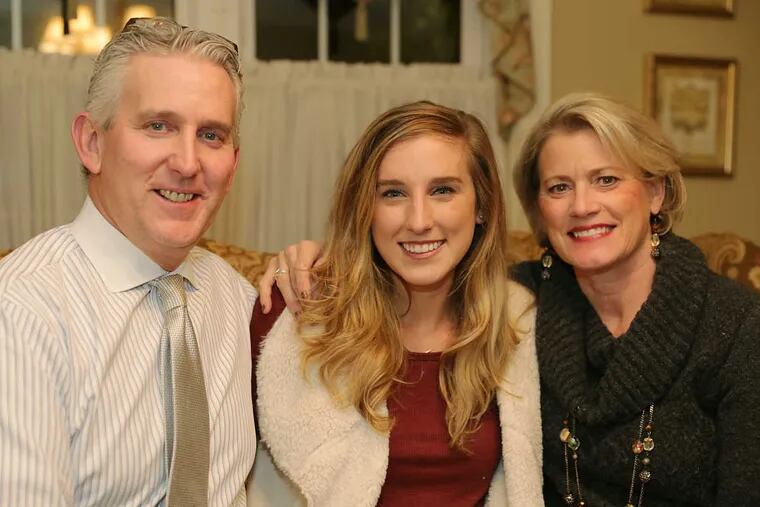 Meagan McLaughlin, 24, poses for picture with her parents, Michael McLaughlin and Linda McLaughlin at their Haddonfield, N.J. home.