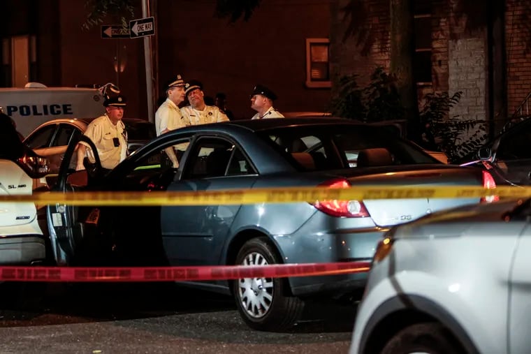 Police at the scene of a fatal shooting that occurred during an attempted carjacking on the 1100 block of Porter Street in South Philadelphia, Wednesday, July 12, 2023.