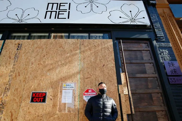 Mei Mei owner and executive chef Jay Ho stands in front of his shuttered Old City restaurant and lounge on Monday, December 28, 2020.