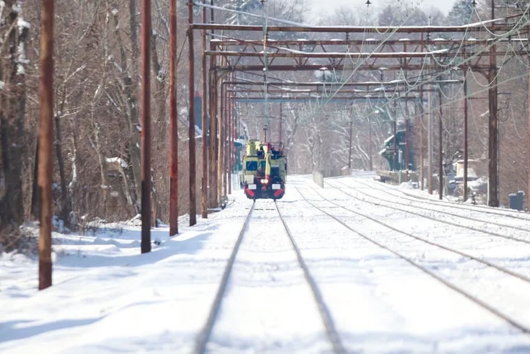 A SEPTA utility engine travels west along the Paoli / Thorndale line at Saint Davids Station Thursday February 6, 2014.