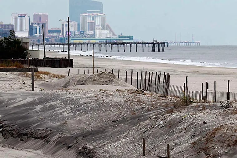 A dune in Margate, looking toward Atlantic City. The state is being delayed in an effort to install protective dunes as a post-Sandy move.