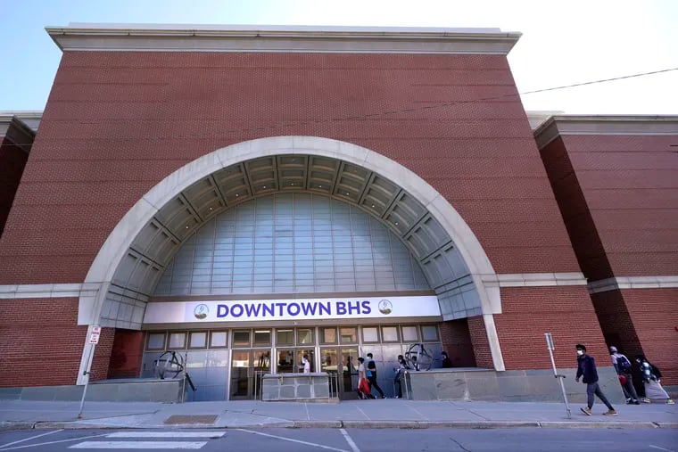 Students enter Downtown Burlington (Vt.) High School through a giant storefront arch last month. Students who once shopped at a downtown mall are now attending high school in the mall's former Macy's department store.