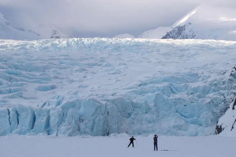 Skiers visit the Portage Glacier, a major tourist site shrinking due to warming. More than 3.5 trillion tons of water have melted off of Alaska's glaciers since 1959, when Alaska first became a state, studies show.