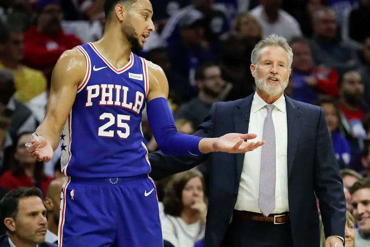 Sixers guard Ben Simmons with Head Coach Brett Brown against the Chicago Bulls on Thursday, October 18, 2018 in Philadelphia.  YONG KIM / Staff Photographer