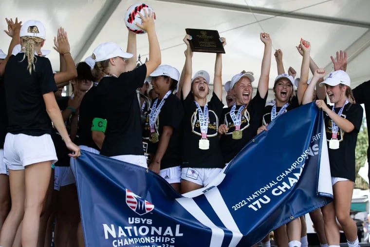 Players from the Philadelphia Soccer Club's Coppa Rage under-17 girls team celebrate after winning a U.S. Youth Soccer national championship on Sunday.
