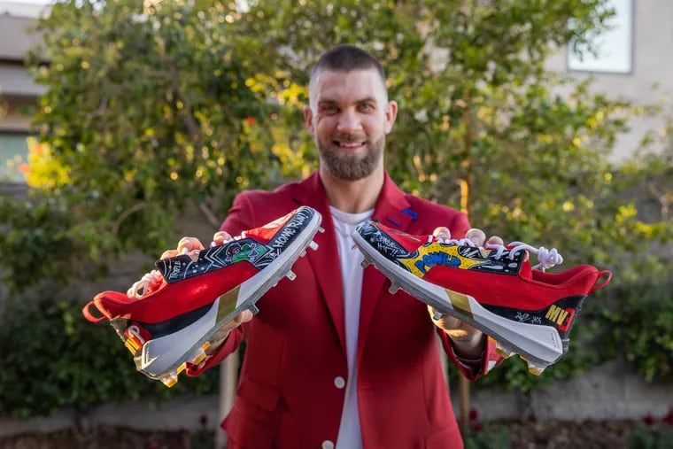 Bryce Harper shows off his MVP cleats customized by members of a Camden youth baseball team.