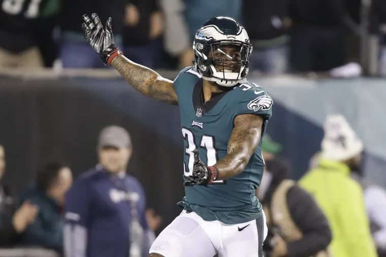 Eagles cornerback Jalen Mills celebrating after teammate Patrick Robinson ran back an interception for a first-quarter touchdown against the Vikings in the NFC championship game.