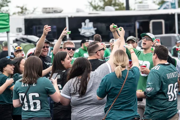It's Jello shots time for these Eagles fans tailgating outside the Linc Sunday morning before the start of the season home opener against the Washington Redskins.