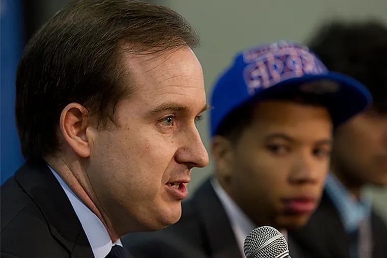 Sam Hinkie and Michael Carter-Williams together after the 2013 NBA draft, but midway through this season, MCW was gone. (Alejandro A. Alvarez/Staff file photo)
