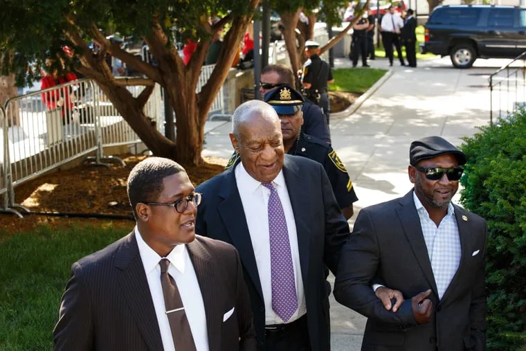 Bill Cosby arrives for his sexual assault trial on Friday, June 9, 2017 at the Montgomery County Courthouse in Norristown, Pa. with comedian Joe Torry, right, and Anthony Wyatt, his spokesman, left.
