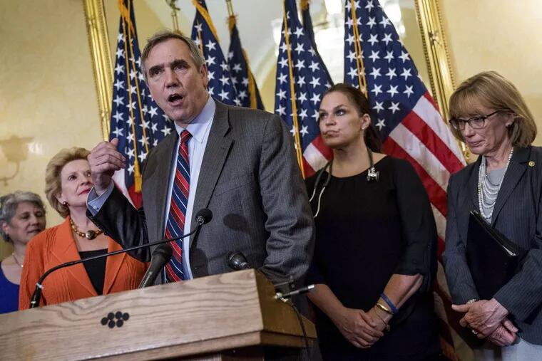 Sen. Jeff Merkley (D-Ore.), third from left; accompanied by Sen. Debbie Stabenow (D-Mich.), second from left; Sen. Maggie Hassan (D-N.H.), right; and healthcare leaders, discuss the effects of the proposed Republican health-care legislation.