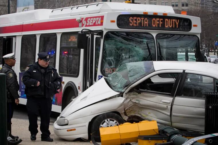 Philadelphia and SEPTA police at the scene of an accident today, April 7, 2014, involving a bus and car at N. 22nd and Ben Franklin Parkway. ( ALEJANDRO A. ALVAREZ / STAFF PHOTOGRAPHER )