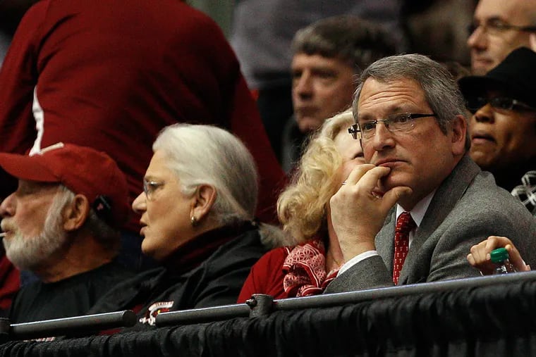 Former Temple president Neil D. Theobald watches as Temple plays Indiana.