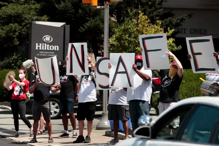 UNITE HERE, a union that represents Philly hotel workers, makes some noise on Columbus Blvd. in front of the Hilton Philadelphia at Penn's Landing in Phila., Pa. on July 12, 2020. The union is fighting for reduced workload and safer working conditions during the pandemic.
