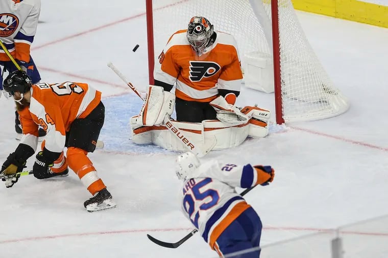 Flyers goalie Carter Hart stops a shot  from the Islanders' Sebastian Aho during the first period Tuesday at the Wells Fargo Center.