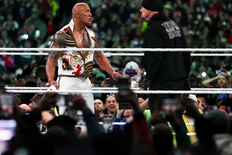 Dwayne "The Rock" Johnson gets a stare down from The Undertaker during a wild main event at WrestleMania 40 last month.