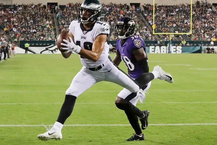 Eagles wide receiver J.J. Arcega-Whiteside catches a third-quarter touchdown past Baltimore Ravens cornerback Stanley Jean-Baptiste in a preseason game Thursday, August 22, 2019 in Philadelphia.