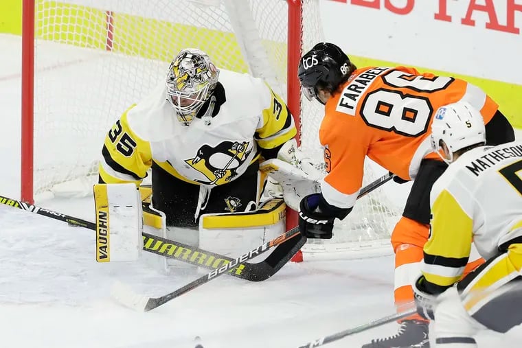 Flyers right wing Joel Farabee scores a second period goal past Pittsburgh Penguins goaltender Tristan Jarry and defenseman Mike Matheson on Wednesday, January 13, 2021 in Philadelphia