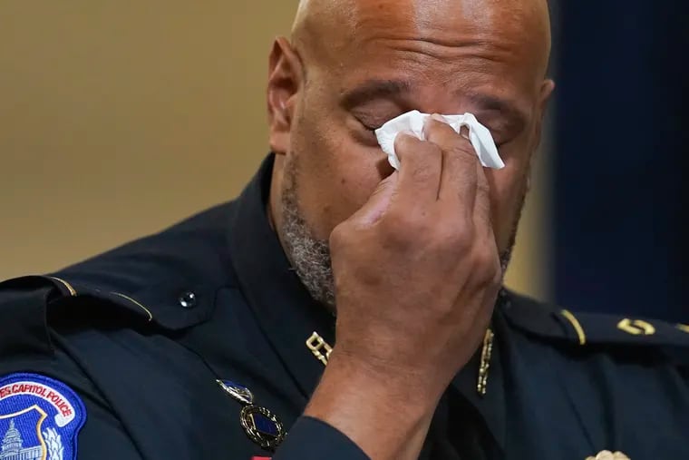 Washington Metropolitan Police Department officer Daniel Hodges wipes his eyes during the House select committee hearing on the Jan. 6 attack on Capitol Hill.
