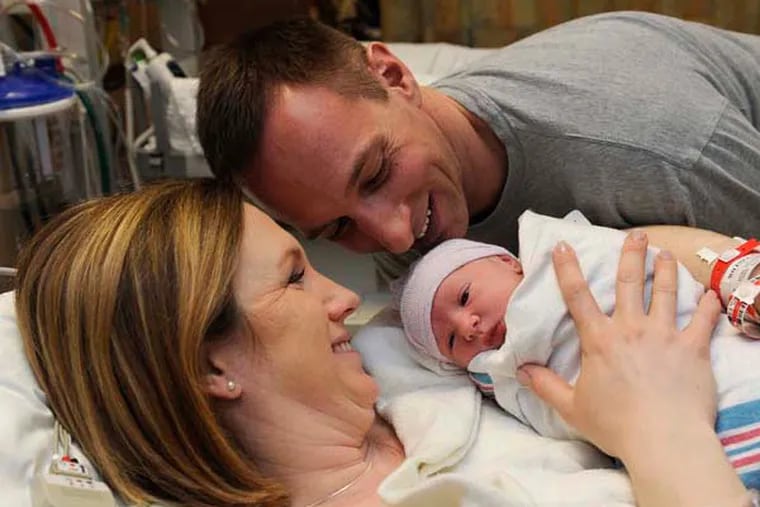 Lauren and Joe Wilusz bond with their new daughter, Katie, in the recovery room on March 18, 2015 at Anne Arundel Medical Center in Annapolis, Md. Kathryn Marie Wilusz was born in a scheduled C-Section at 11:14 a.m. at Anne Arundel Medical Center. The family  participated in the hospital's new family-centered C-section program. (Barbara Haddock Taylor/Baltimore Sun/TNS)