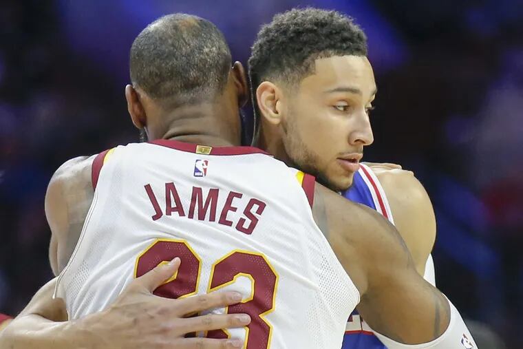 Ben Simmons and LeBron James hugging before a Sixers-Cavaliers game in November.