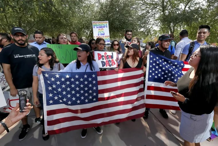 Earlier this year in Phoenix, DACA supporters march to the U.S. Immigration and Customs Enforcement office. A new poll shows wide support in three battleground states for the program, which allows children who were unlawfully brought into the country by immigrant parents to live and work in the United States. Many grew up here, knowing no other country.