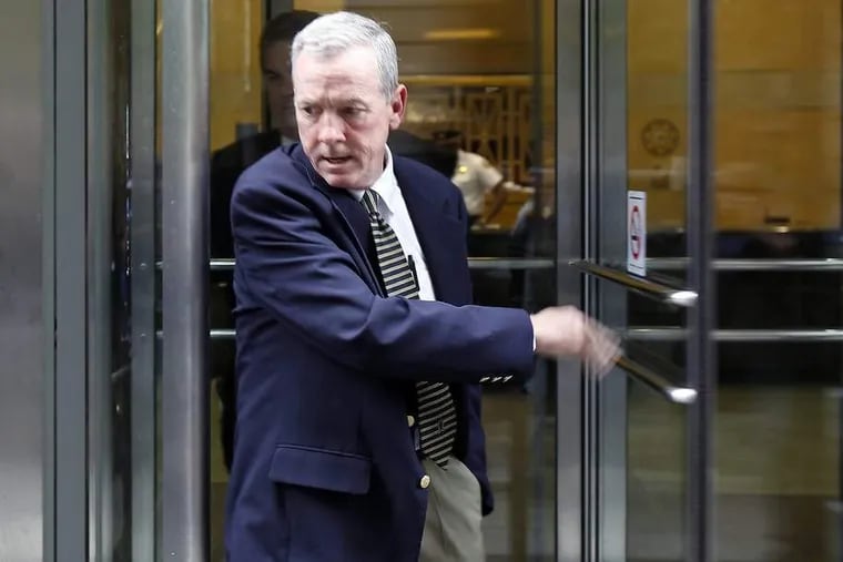 The Rev. James Brennan leaves the Criminal Justice Center in Philadelphia after a session of his 2012 trial.