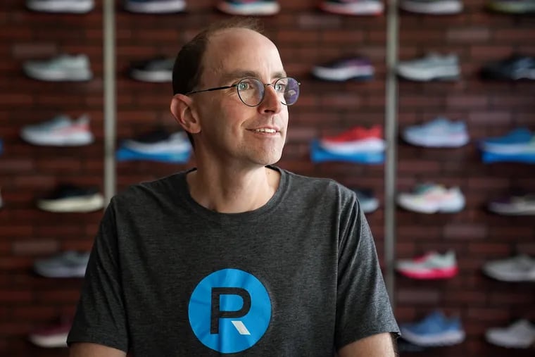 Ross Martinson, owner of Philadelphia Runner, in his University City store. His company's Center City store at 1601 Sansom St. was ransacked during civil unrest last May. He plans to reopen in Center City this summer at a new location, 1711 Walnut St., this summer.
