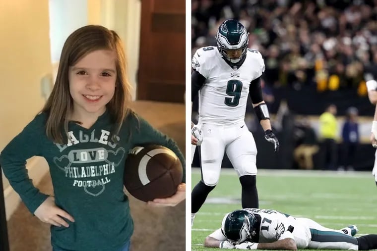 Left: Abigail Johnson, 8, of West Chester, roots for the Eagles. (Photo courtesy of Raymond Johnson).

Right: Philadelphia Eagles quarterback Nick Foles, center, looks down at Eagles wide receiver Alshon Jeffery after the football bounced out of his hands and was intercepted by New Orleans Saints cornerback Marshon Lattimore in the NFC divisional game. (David Maialetti / Staff Photographer).