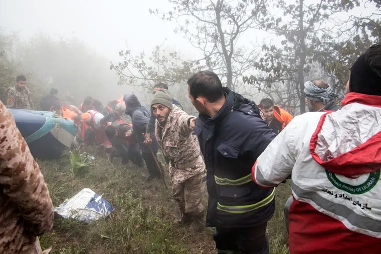 Rescue team members work at the scene of a crash of a helicopter carrying Iranian President Ebrahim Raisi in Varzaghan in northwestern Iran on Monday, May 20, 2024. Raisi, the country’s foreign minister and several other officials were found dead.