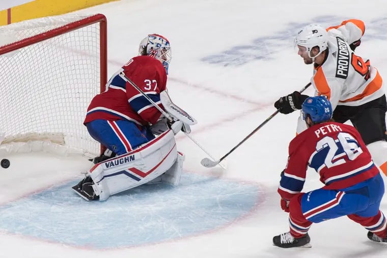 Ivan Provorov scores the winner against Montreal Canadiens goaltender Keith Kinkaid as Jeff Petry defends during overtime.