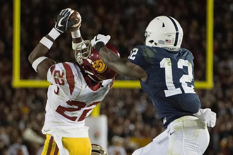 USC defensive back Leon McQuay jumps in front of Penn State receiver Chris Godwin to intercept a pass with 27 seconds left in the 103rd Rose Bowl Game.