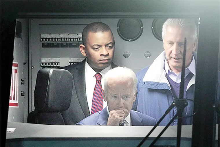 He thinks he can: Joe Biden sits at the controls of the new locomotives unveiled at 30th Street Station.