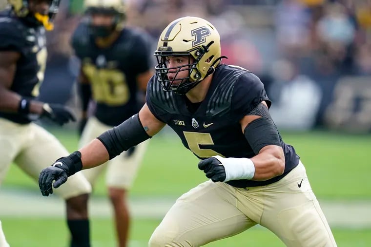 Purdue defensive end George Karlaftis (5) plays against Wisconsin during the first half of an NCAA college football game in West Lafayette, Ind., Saturday, Oct. 23, 2021. (AP Photo/Michael Conroy)
