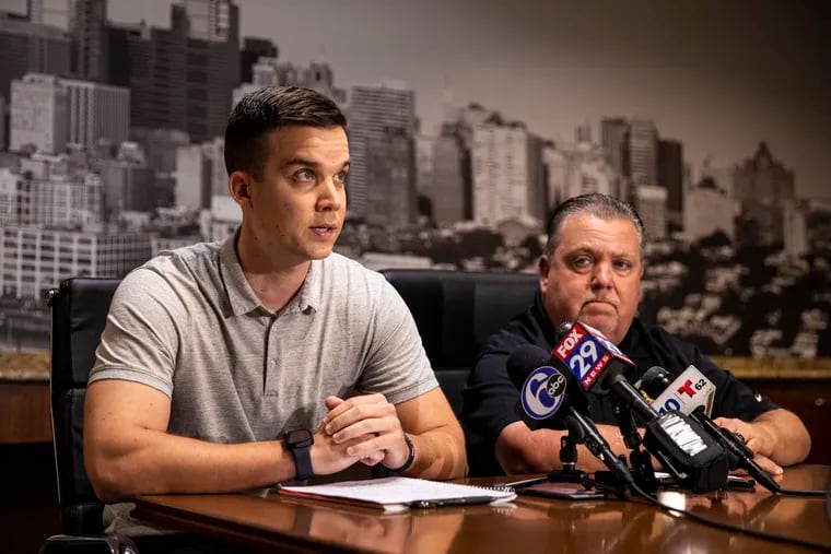 Former Philadelphia Police Officer Patrick Keller, 28, who was shot while responding to a domestic call in 2020, speaks to reporters alongside FOP President John McNesby (right), about a plea deal offered to his alleged assailant.