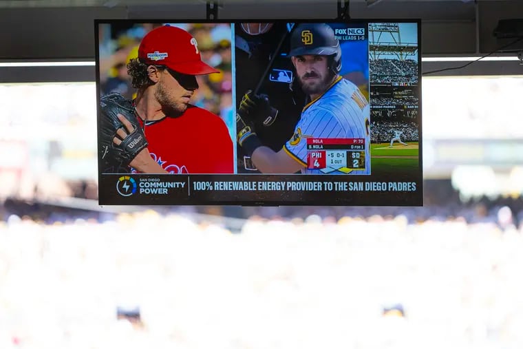 A TV monitor shows Phillies pitcher Aaron Nola pitching to his brother, Padres catcher Austin, in the fifth inning.