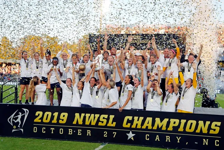 The North Carolina Courage celebrate with the championship trophy following their win over the Chicago Red Stars in the NWSL championship game.