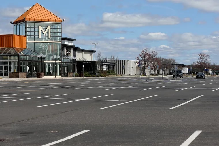 The Moorestown Mall parking lot was empty in March after malls and other nonessential retail businesses were ordered closed due to the coronavirus pandemic. Owner PREIT is now selling some of the land for development.