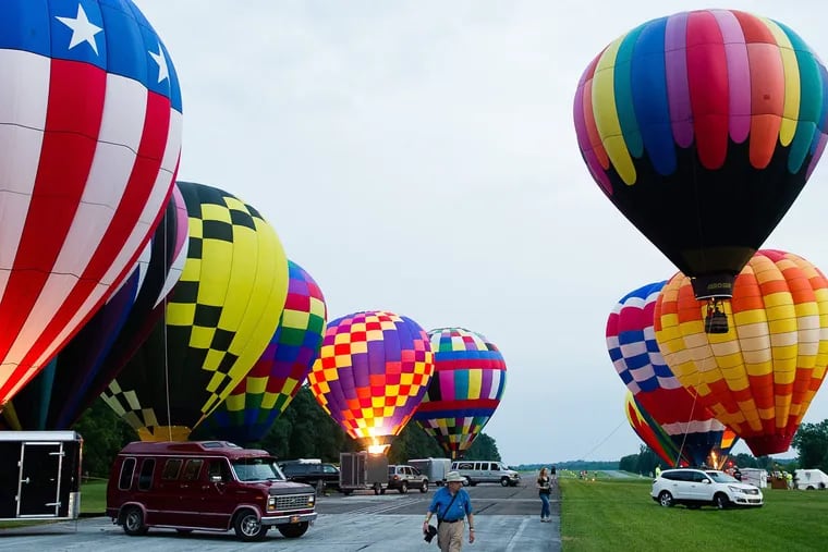Gaze up at over 20 hot air balloons taking flight twice per day in Toughkenamon during the Chester County Balloon Festival.