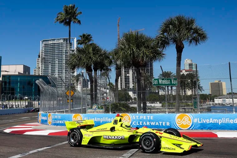 FILE - In this March 9, 2018, file photo, the City of St. Petersburg is pictured in the background as IndyCar driver Simon Pagenaud makes his way through turn 10 during the first IndyCar practice on the first day of the Firestone Grand Prix of St. Petersburg, Fla. The IndyCar season opens Sunday, March 10, 2019, in St. Petersburg. (Dirk Shadd / Tampa Bay Times via AP, File)